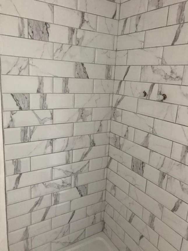marble-effect shower tiling